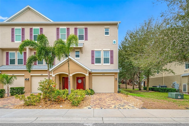 townhome / multi-family property featuring a garage