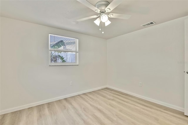 empty room featuring ceiling fan and light hardwood / wood-style flooring