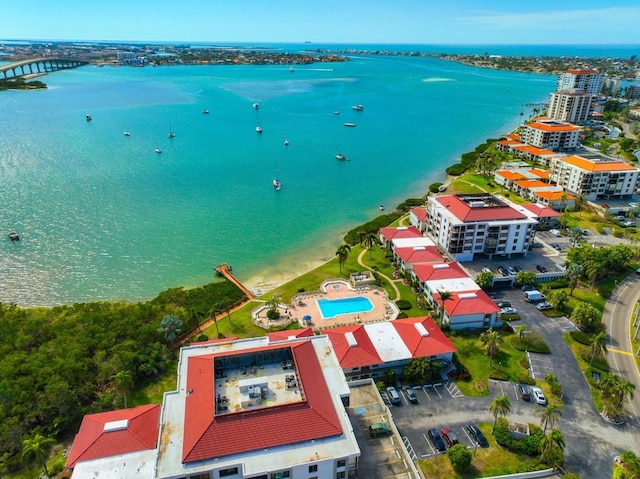 drone / aerial view featuring a water view and a city view