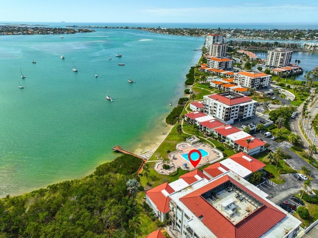 bird's eye view featuring a water view and a view of city