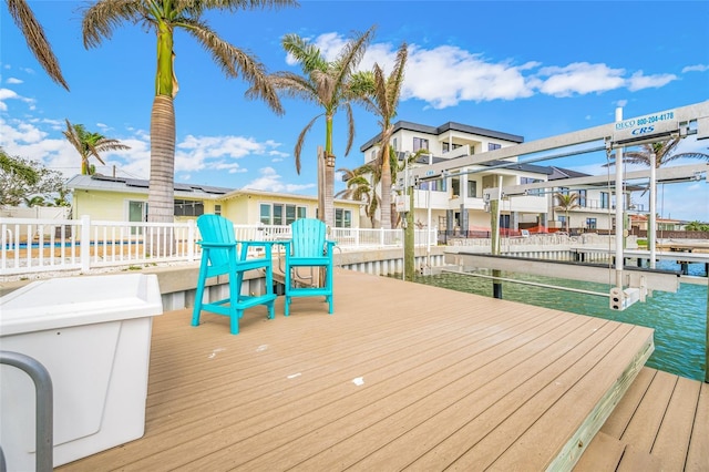 deck with a water view and a boat dock