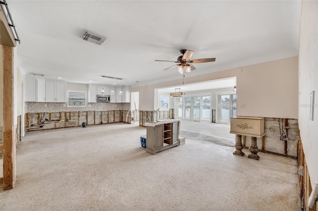 living room featuring ceiling fan