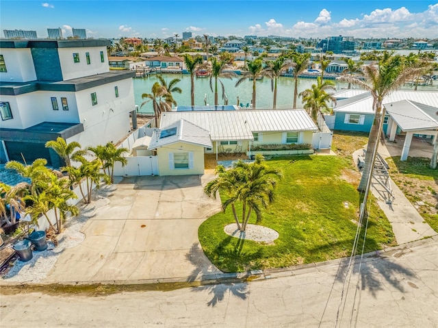 birds eye view of property with a water view