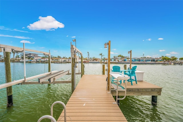 view of dock featuring boat lift and a water view