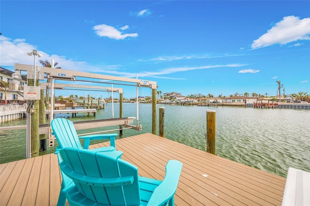view of dock with a water view and boat lift