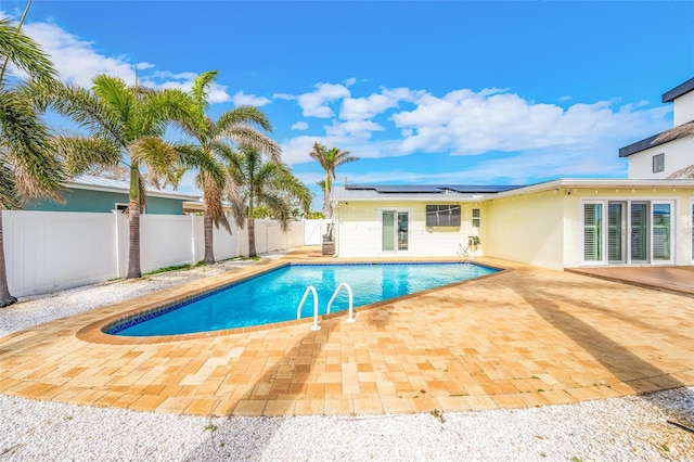 view of pool featuring a patio, a fenced backyard, and a fenced in pool