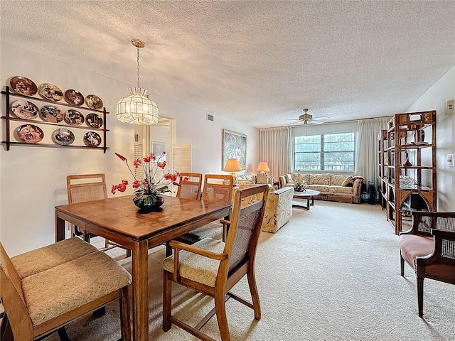 8174 Terrace Garden Dr N Unit 307, Saint Petersburg, FL 33709 - carpeted dining space featuring ceiling fan and a textured ceiling