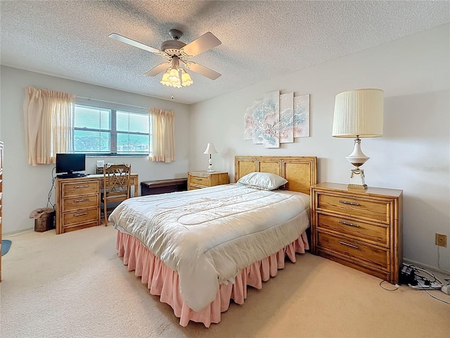 8174 Terrace Garden Dr N Unit 307, Saint Petersburg, FL 33709 - carpeted bedroom with ceiling fan and a textured ceiling