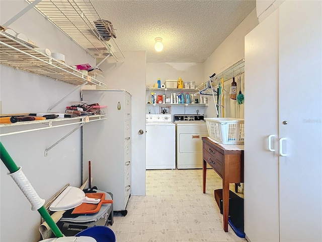 8174 Terrace Garden Dr N Unit 307, Saint Petersburg, FL 33709 - washroom featuring independent washer and dryer and a textured ceiling