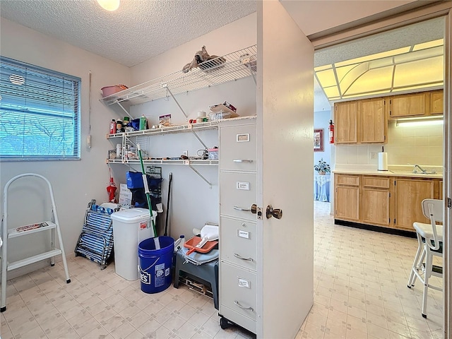 8174 Terrace Garden Dr N Unit 307, Saint Petersburg, FL 33709 - laundry area with a textured ceiling