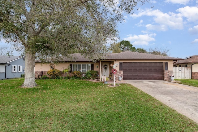 ranch-style home featuring a garage and a front lawn