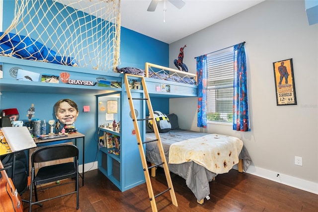 bedroom with wood finished floors, a ceiling fan, and baseboards