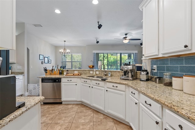 kitchen with visible vents, decorative backsplash, white cabinets, a sink, and dishwasher