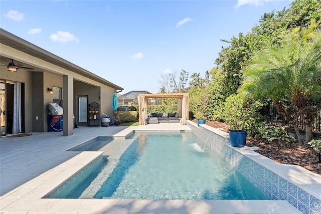 view of swimming pool featuring a patio area, fence, and an outdoor living space