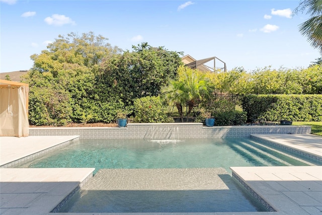 view of swimming pool with fence and a fenced in pool