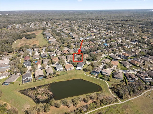 drone / aerial view featuring a water view and a residential view