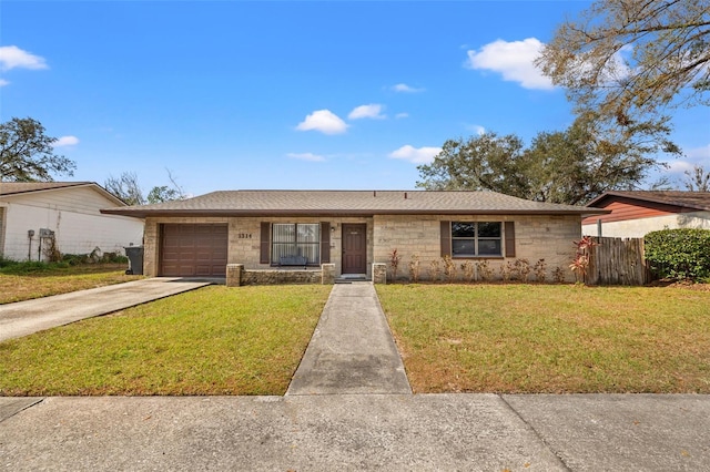 single story home with a garage and a front yard