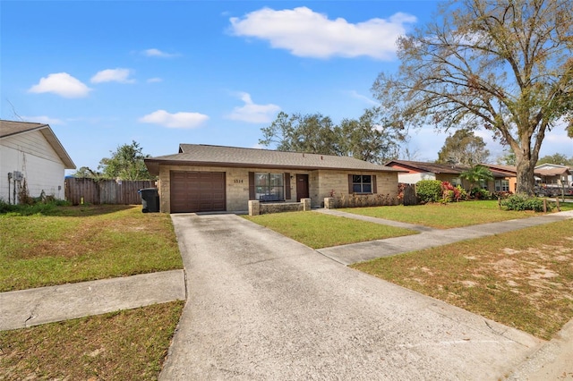 ranch-style home with a garage and a front yard