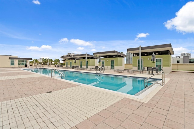 community pool with a patio area