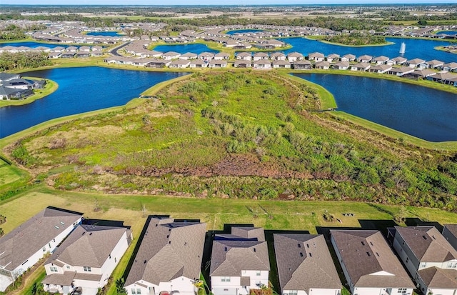 bird's eye view featuring a residential view and a water view