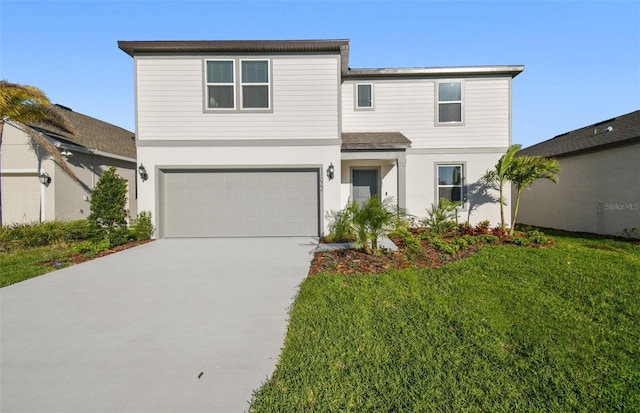 view of front of property with a garage, concrete driveway, and a front lawn