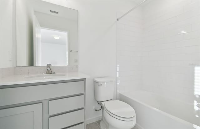 full bathroom with toilet, visible vents, vanity, baseboards, and washtub / shower combination