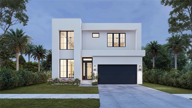 view of front of property featuring a garage and a front yard