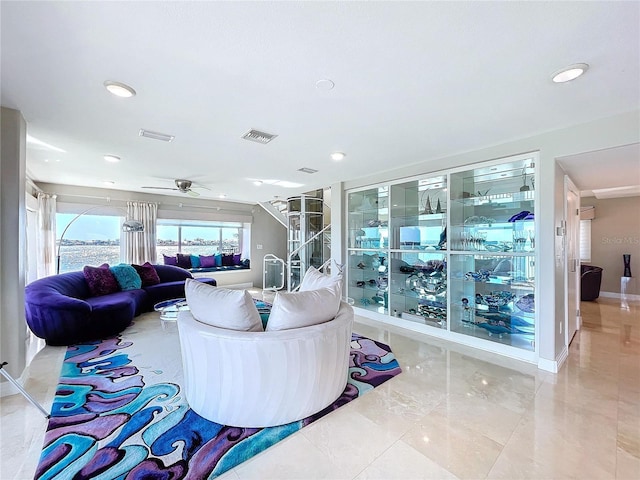 living room with recessed lighting, visible vents, and baseboards