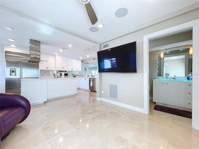 kitchen featuring visible vents, white cabinets, decorative backsplash, appliances with stainless steel finishes, and light countertops