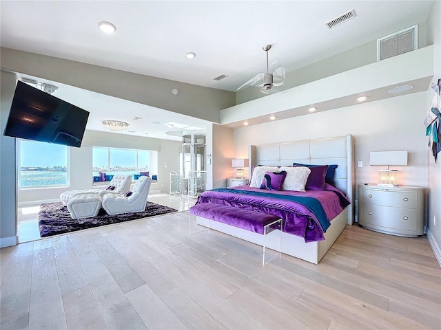 bedroom featuring light wood-type flooring, visible vents, baseboards, and recessed lighting