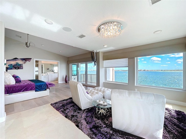 bedroom featuring a water view, visible vents, baseboards, vaulted ceiling, and access to exterior