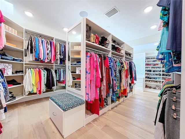 spacious closet featuring light wood finished floors and visible vents