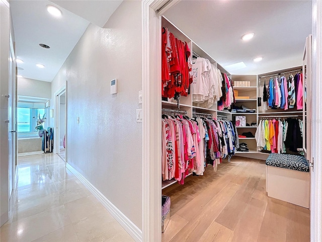 spacious closet featuring light wood finished floors