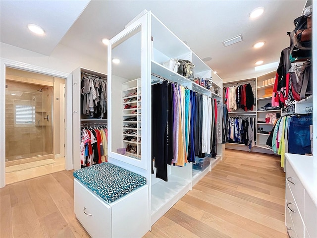 spacious closet featuring light wood-style flooring and visible vents