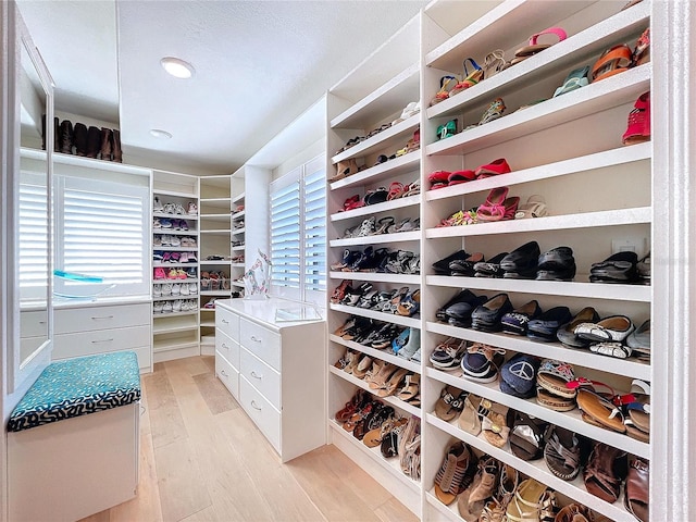 spacious closet with light wood-style flooring