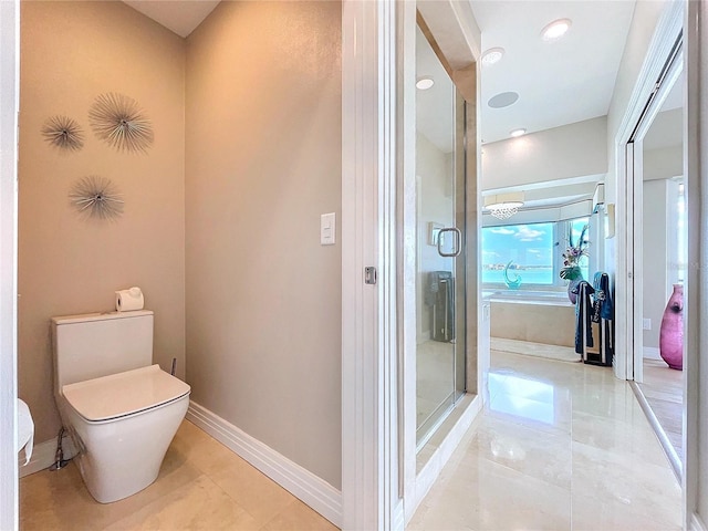 bathroom with baseboards, toilet, a garden tub, tile patterned flooring, and a shower stall