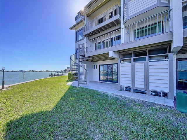 exterior space with a water view and stairway