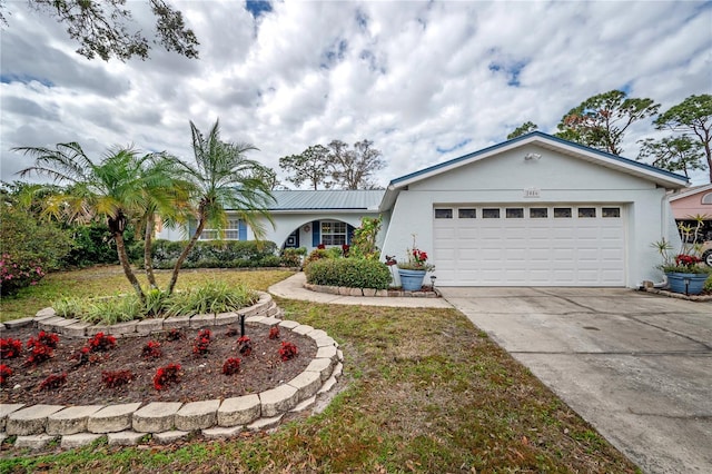 ranch-style home featuring a garage and a front yard