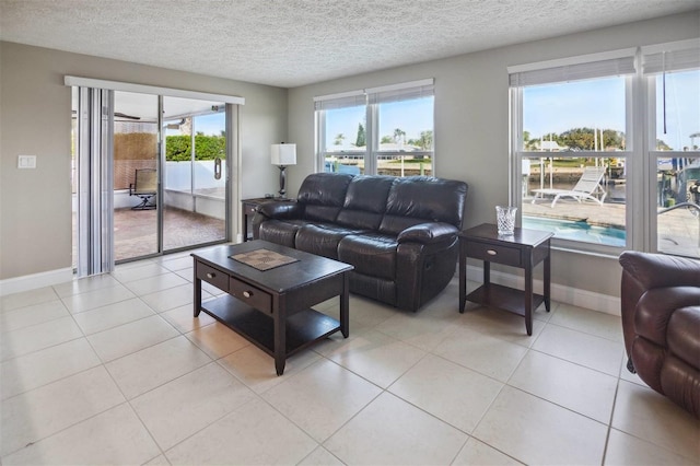 tiled living room with a textured ceiling