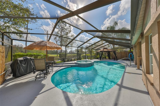 view of swimming pool featuring grilling area, a lanai, a patio area, and an in ground hot tub