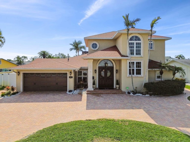 mediterranean / spanish-style house featuring a garage