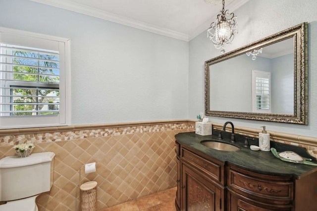 bathroom with tile walls, tile patterned flooring, vanity, ornamental molding, and toilet