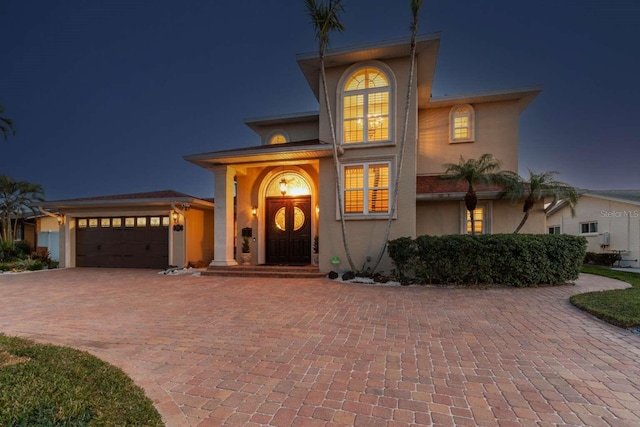 view of front of property with a garage