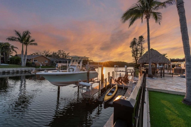 view of dock with a water view and a gazebo