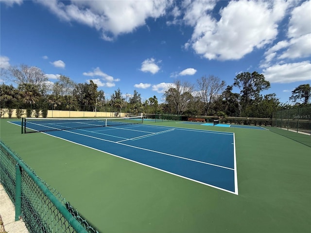 view of sport court featuring basketball hoop