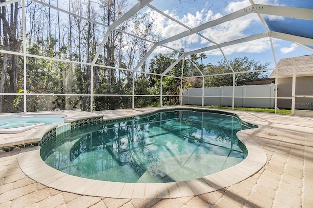 view of pool featuring a patio area and glass enclosure