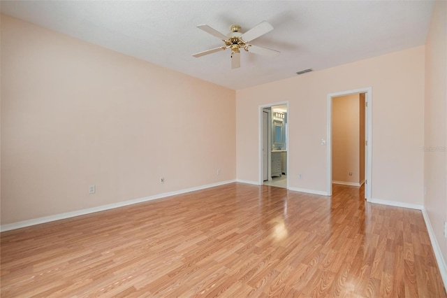 unfurnished room featuring light hardwood / wood-style floors and ceiling fan