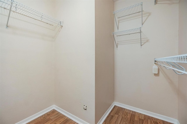 walk in closet featuring hardwood / wood-style floors