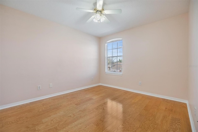 spare room featuring ceiling fan and light wood-type flooring