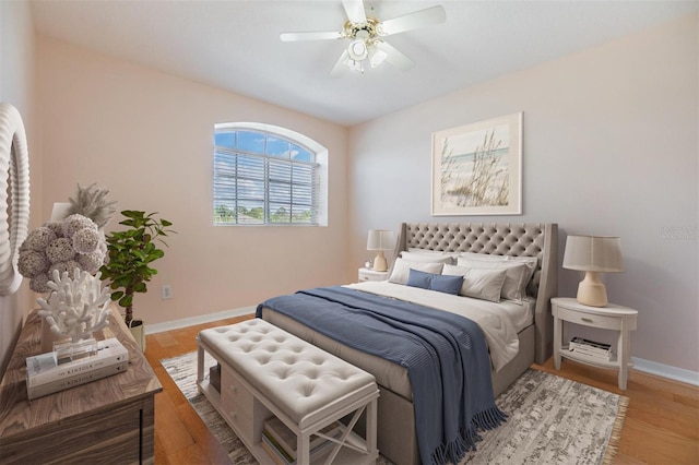 bedroom with hardwood / wood-style floors and ceiling fan